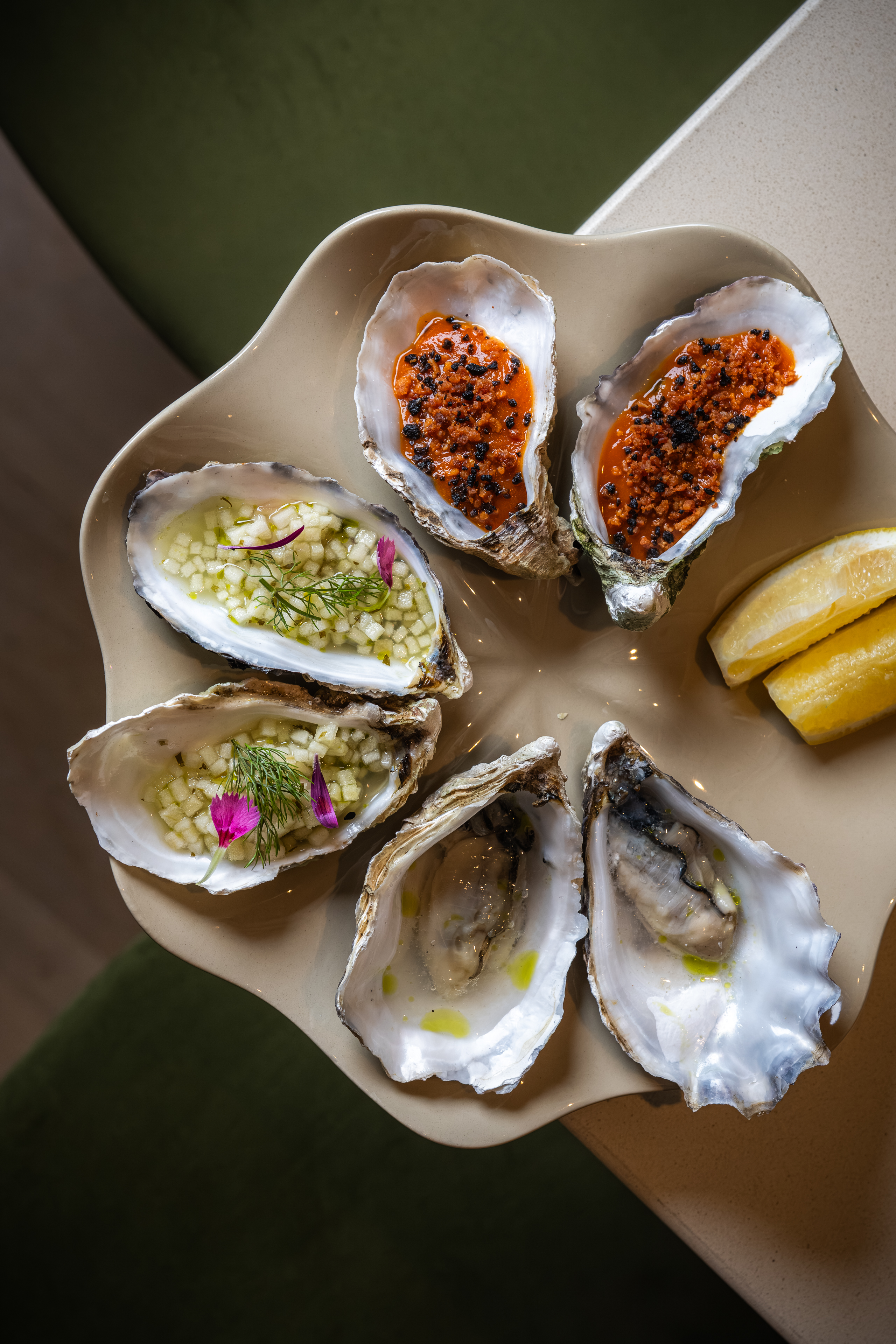 A plate of oysters with dressings and lemon at Orion by Alex Webb in Wimbledon Village.